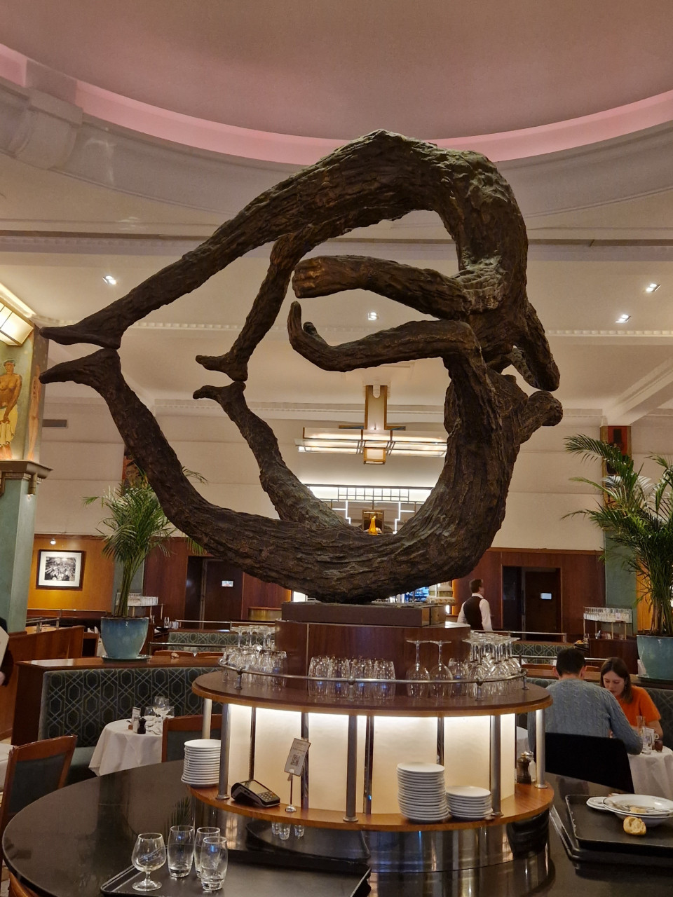 A sculpture of a heart in a restaurant
Description automatically generated